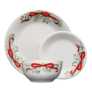 The Fiesta Holly Berry Christmas Garland Classic Bistro Coupe 3-Piece Place Setting includes a large plate, small plate, and bowl, each adorned with festive red ribbons, pine branches, and berries for a cheerful holiday table.