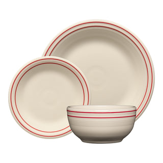 The Fiesta Americana Scarlet Band Classic Bistro 3-Piece Place Setting, Service for 1, features cream-colored ceramic dishes with thin red rim stripes, arranged overlapping on a white background. Made in the USA.