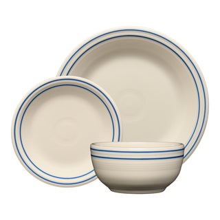 The Fiesta Americana Lapis Band Classic Bistro 3-Piece Place Setting includes a large plate, small plate, and bowl, all cream with blue rim bands. Service for 1. Made in USA.