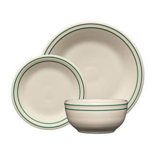 Three cream-colored dishes with green stripes—part of the Fiesta Americana Jade Band Classic Bistro 3-Piece Dinnerware Set, Service For 1—are arranged overlapping on a white background. Proudly made in the USA by Fiesta, this set includes a dinner plate, a salad plate, and a bowl.