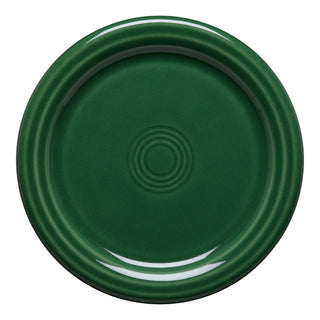 The Fiesta 4 3/8 Inch Coaster and Mug Cover by Fiesta features a round, jade ceramic design with a glossy finish and concentric circle patterns, shown on a white background. Microwave safe—ideal as a coaster or cover for your mug.