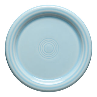 The Fiesta 4 3/8 Inch Coaster and Mug Cover by Fiesta features a sky-colored, round ceramic design with smooth concentric ridges, viewed from above on a white background. Microwave safe for everyday use.