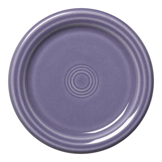 The Lavender Fiesta 4 3/8 Inch Coaster and Mug Cover by Fiesta is a round, lavender ceramic piece with concentric ridges near the edge, a glossy finish, and is made in the USA—shown from a top view.