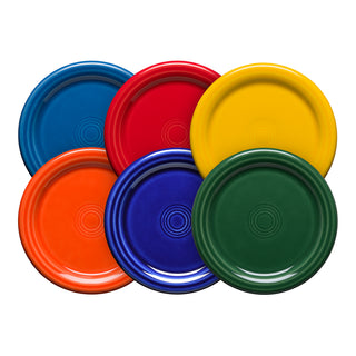Six colorful Fiesta 4 3/8 Inch Coaster and Mug Covers by Fiesta—blue, red, yellow, orange, dark blue, and green—are arranged in an overlapping circle, resembling a vibrant set.