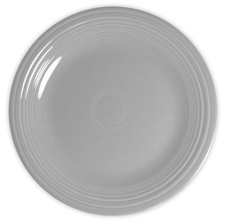 A plain, round, light gray ceramic plate with a smooth surface and concentric raised rings near the rim, viewed from above on a white background.