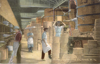 Workers in early 20th-century attire load large ceramic pots onto racks in a bustling pottery factory, surrounded by shelves of dishes and large kilns. Text at the bottom reads: Loading Kiln, Homer Laughlin China Co., Newell, W. Va.