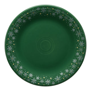 The Fiesta Snowflake Classic Rim 10 1/2 Inch Dinner Plate in jade features white and silver snowflakes, making it an ideal festive addition to your holiday tableware collection.
