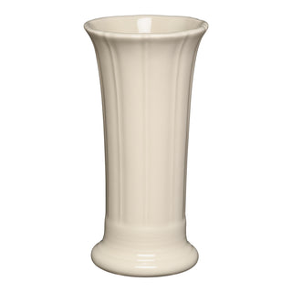 The Fiesta Retired Linen Small Flower Vase features a tall, cream-colored ceramic design with a flared rim, vertical grooves, and rounded base. It stands 7.5 inches high and is shown on a white background.