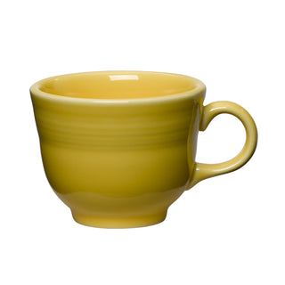 A Sunflower yellow Retired Classic 7 3/4 OZ Tea Cup by Fiesta with handle, seen from the side against a white background. This lead-safe china cup brightens any setting.