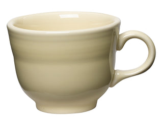 The Fiesta Retired Classic 7 3/4 OZ Tea Cup in Ivory is a lead-safe ceramic mug with a rounded body and curved handle, made in the USA—ideal for collectors of discontinued items.