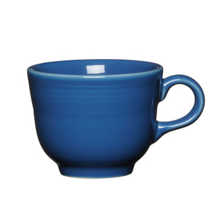 The Fiesta Retired Classic 7 3/4 OZ Tea Cup in Lapis is a plain, ceramic blue cup with a handle, crafted from lead-safe china and photographed against a white background.
