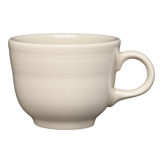 The Fiesta Retired Classic 7 3/4 OZ Tea Cup in Linen is a cream-colored cup with a rounded shape and large handle, made from lead-safe china, shown on a white background.