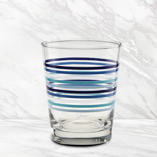 The Moderne Glass Fiesta Coastal Blues Thin Stripe 15 oz. Tapered Double Old Fashion glasses (set of 4) feature horizontal blue and navy stripes and expert craftsmanship, made in the USA.