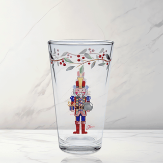 The Nutcracker The Giver 16 oz. Cooler Glass Set of 4 by Moderne Glass features festive nutcracker and berry designs—ideal Christmas glassware to add to your holiday dinnerware collection.