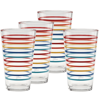 Set of four 16 oz. Fiesta Vibrant Thin Stripe Cooler Glasses by Moderne Glass, featuring colorful horizontal stripes in red, yellow, blue, and orange. Inspired by Fiesta Dinnerware and proudly made in the USA.