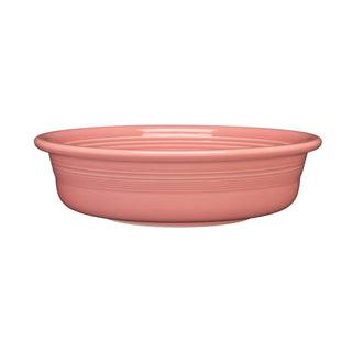 The Fiesta Retired Classic Rim 10 1/2 Inch Extra Large Serving Bowl in Peony is a round, shallow pink lead-free china bowl with subtle horizontal ridges, a smooth surface, and dishwasher safe. Capacity: 80 oz.