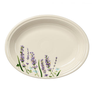 Fiesta Lavender Bloom 11 5/8 Inch Medium Oval Serving Platter in off-white with a painted lavender floral design on one side.