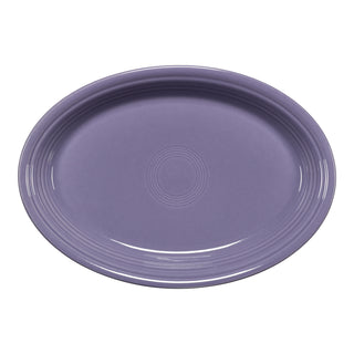 The Fiesta Lavender 13 5/8 Inch Large Oval Serving Platter features a glossy finish, simple raised circular pattern at the center and rim, and is made in the USA.