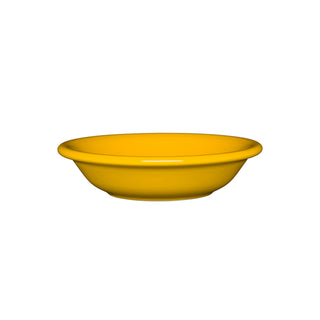 The Fiesta Fruit Bowl 6 OZ in daffodil is a bright yellow ceramic bowl with a smooth, glossy finish, slightly flared rim, and shallow design. Shown on a white background, this bowl is microwave safe.
