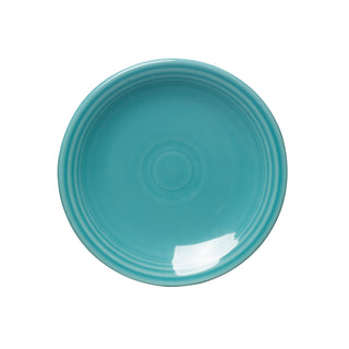 The Fiesta Retired Classic Rim 6 1/8 Inch Appetizer Plate in turquoise features a glossy finish with concentric ridges, viewed from above on a white background; made from dishwasher safe china.