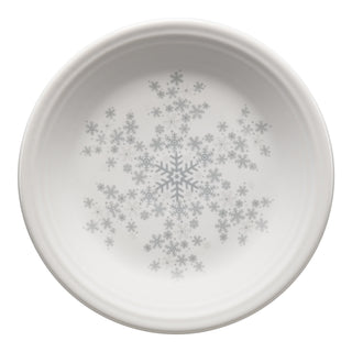 The Fiesta White Snowflake Classic Rim 7 1/4 Inch Salad Plate features light gray snowflakes at the center spreading outward and a raised, ridged rim—perfect festive dinnerware for holiday table settings.