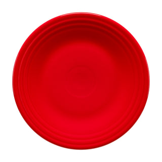 A round, bright red 9 inch Classic Rim 9 Inch Luncheon Plate by Fiesta, featuring a concentric ridged rim and viewed from directly above.