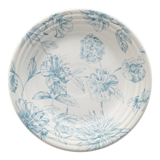 The Fiesta Botanical Floral Sky Classic Rim 9 Inch Luncheon Plate is a round white ceramic plate made in the USA, featuring a light blue botanical floral pattern with large blossoms and leaves, shown from above.