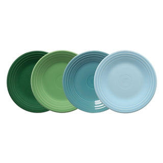 The Fiesta Mixed Aegean Classic Rim 9 Inch Luncheon Plate Set includes four USA-made plates in dark green, light green, teal, and light blue, each featuring a simple rimmed design and arranged side by side.