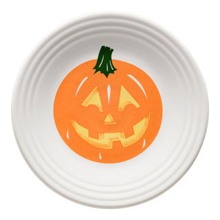 The Fiesta Retired Jack-o-Lantern Pumpkin Classic Rim 9 Inch Luncheon Plate is a white ceramic plate made in the USA, featuring a smiling orange jack-o'-lantern with carved face and green stem in the center, shown from above on white.