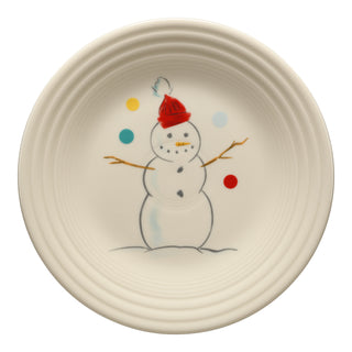 The Fiesta Jolly Christmas Snowman Classic Rim 9 Inch Luncheon Plate is a round white, USA-made plate with a simple snowman design, red hat, ribbed edge, colorful dots, and is dishwasher safe.