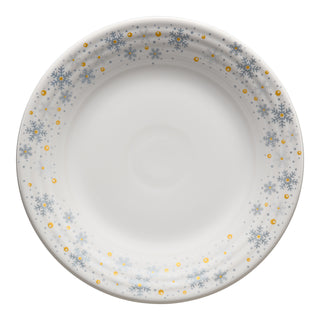 The Fiesta White Snowflake Classic Rim 9 Inch Luncheon Plate, made in the USA, features blue snowflakes and gold dots on white ceramic—perfect festive dinnerware as seen from above.