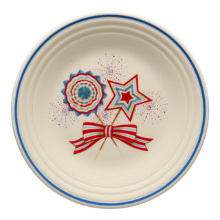 The Fiesta Americana Fan, Star, & Bow Classic Rim 9 Inch Luncheon Plate features a patriotic design with a blue rim and red, white, and blue accents—perfect for your festive dinnerware collection.