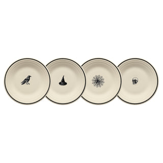 Four Fiesta Halloween Icons 9" ceramic luncheon plates are shown in a row, each with a unique black-rimmed design—a raven, witch hat, spider web, and skull. Set of 4 by Fiesta.