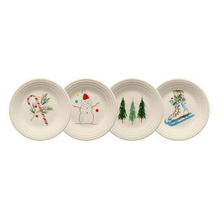 The Fiesta Jolly Christmas Set includes four 9-inch classic rim luncheon plates with festive designs—candy cane, snowman, pine trees, and ice skate—perfect collectible ceramic plates for your holiday gatherings.