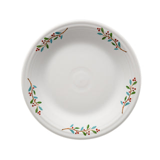The Fiesta Retired Holly Berry Christmas Classic Rim 10 1/2 Inch Dinner Plate features green leaves, red berries, and blue accents on white lead-safe china; a cherished collectible for the holidays.