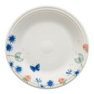 The Fiesta Retired Breezy Floral Classic Rim 10 1/2 Inch Dinner Plate features blue and orange flower details, a blue butterfly along the edge, and is dishwasher safe for easy care.