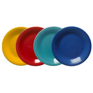 The Fiesta Mixed Vibrant Classic Rim 10 1/2 Inch Dinner Plate Set of 4 features glossy plates in yellow, red, teal, and blue with concentric circles—perfect for adding color to your dinnerware display.