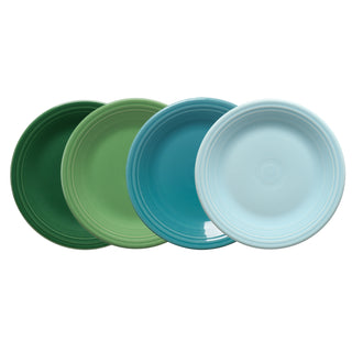 The Fiesta Mixed Aegean Classic Rim 10 1/2 Inch Dinner Plate Set of 4 features art deco-style plates in dark green, light green, teal, and light blue with circular ridge patterns, displayed in a row on a white background.