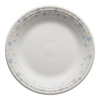 The Fiesta White Snowflake Classic Rim 10 1/2 Inch Dinner Plate features a blue snowflake and gold dot border on lead-safe china. The plate is shown empty, viewed from above against a plain background.