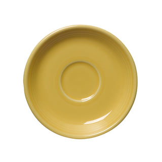 A round Fiesta Retired Classic Rim 5 7/8 Inch Saucer in Sunflower yellow, featuring a raised center ring, viewed from above on a white background. Made in the USA and crafted by Fiesta.