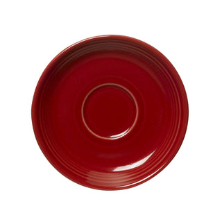 The Fiesta Retired Classic Rim 5 7/8 Inch Saucer in Scarlet features a glossy red finish, a slightly raised rim, and a central circular indent. Viewed from above on white background. Proudly made in the USA and available in signature Fiesta colors.