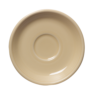 The Fiesta Retired Classic Rim 5 7/8 Inch Saucer in Ivory, made in the USA, features a smooth surface with a central circular indentation and is shown from above against a white background.