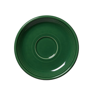 A jade Retired Classic Rim 5 7/8 Inch Saucer by Fiesta, made in the USA, features a slightly raised rim and central circular indentation. It is shown from above against a white background.