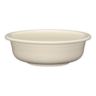 The Fiesta Linen Classic Rim 8 1/4 Inch Large Serving Bowl (40 OZ) is an off-white ceramic piece with a subtle glaze, wide rim, and shallow depth. Made in the USA, it’s perfect for serving meals in style.