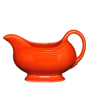 The Retired Fiesta 18 1/2 OZ Gravy Sauceboat in Poppy features a curved spout, rounded handle, and pedestal base—perfect for serving sauces or gravy. Shown against a white background.