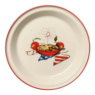 The Fiesta Americana Apple Pie 10 1/4 Inch Deep Dish Pie Baker (44oz) features a red rim and playful pie, apples, sparkler, and American flag art on cream—perfect festive Americana flair for your bakeware collection.