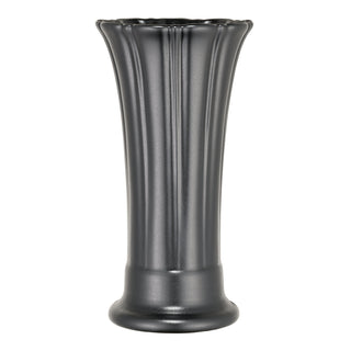 The Fiesta Foundry 9 5/8 Inch Medium Vase features a tall, matte black finish with vertical fluted ribs and a wide rounded base—an elegant nod to classic Art Deco style, shown here against a white background.