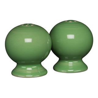 Two round Meadow ceramic salt and pepper shakers from the Retired Fiesta 2 5/8 Inch Set are placed side by side on a white background, featuring a glossy finish and classic Fiesta style.