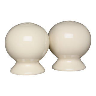The Fiesta Linen 2 5/8 Inch Salt and Pepper Shaker Set features two cream-colored ceramic shakers with small top holes, reflecting classic Art Deco style, shown together on a white background.