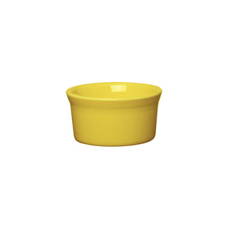 The Fiesta Retired 8 OZ Ramekin, 4 inch, in sunflower yellow, is a small, round ceramic dish with a smooth finish, made in the USA and shown against a plain white background.